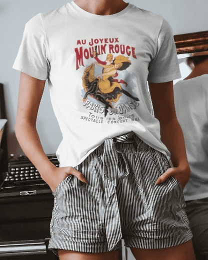 Unisex Moulin Rouge vintage T-shirt with French flair, featuring soft and lightweight fabric, worn by a person in striped shorts