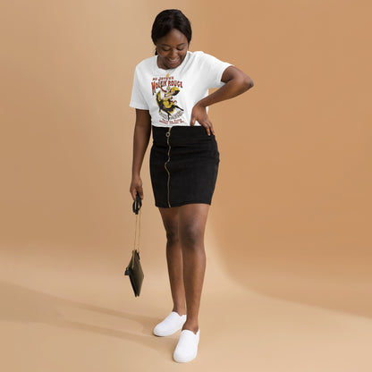 Person wearing a Moulin Rouge vintage unisex t-shirt paired with a black skirt and white sneakers, holding a black purse.